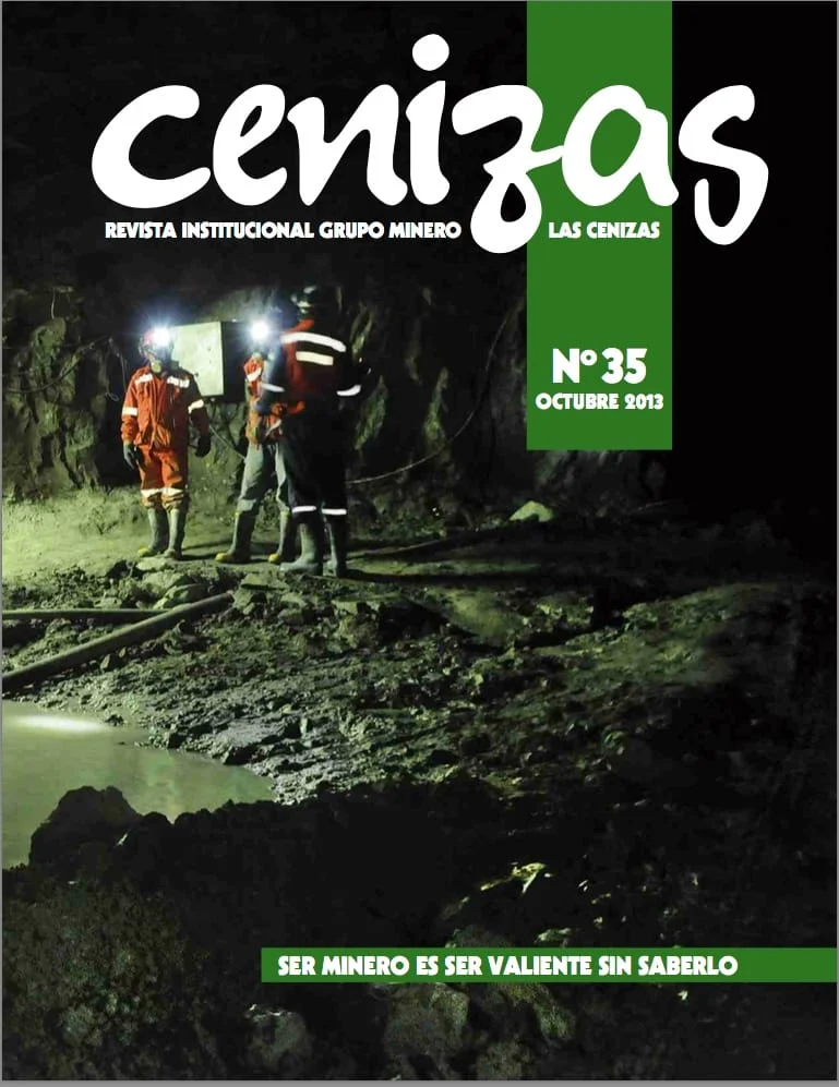 Portada revista minera con trabajadores en mina subterránea