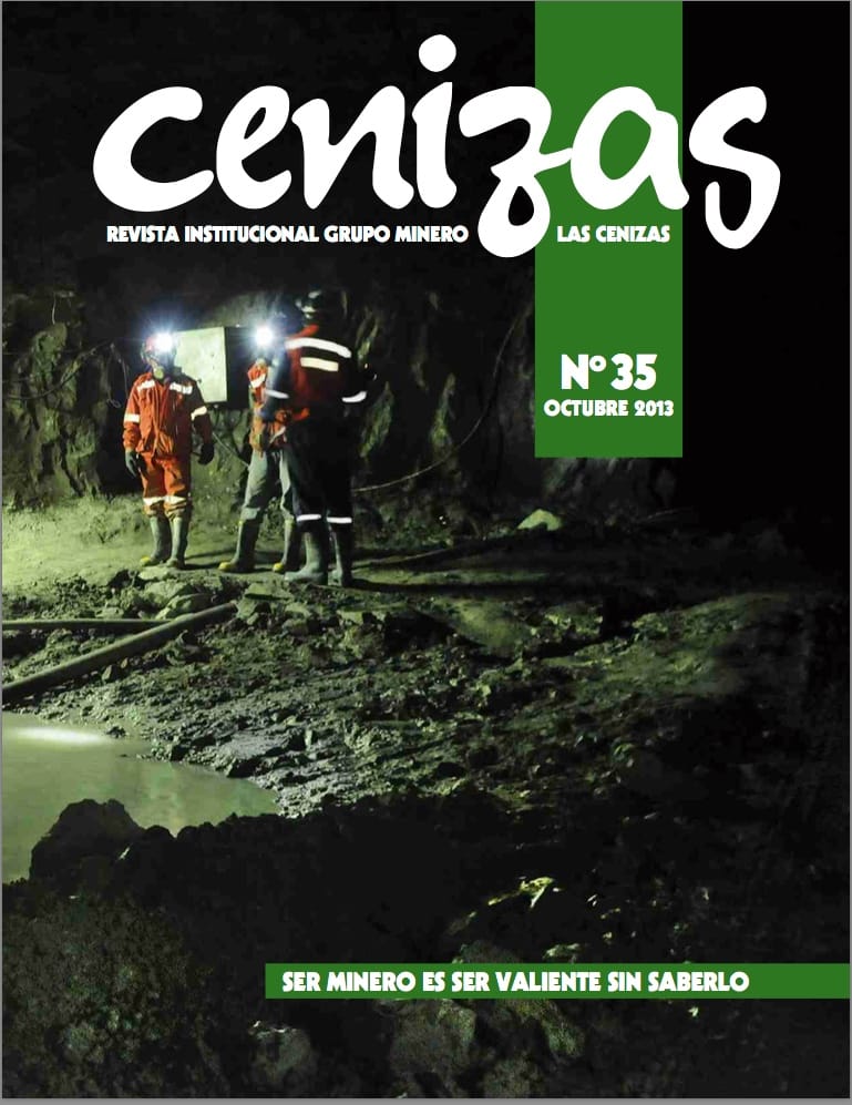 Portada revista minera con trabajadores en mina subterránea